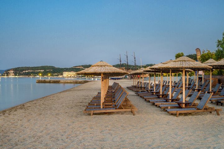 A wooden ship moored in the bay at evening