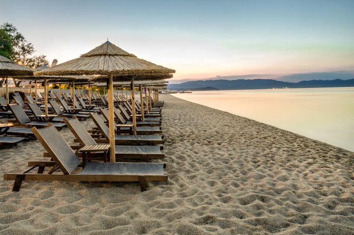 Quiet sunset over the bay with distant mountains