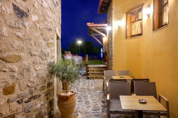 Stone passage and outdoor seating at night