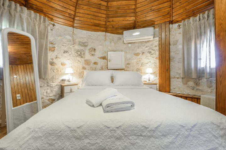 Bedroom with double bed and full-length mirror