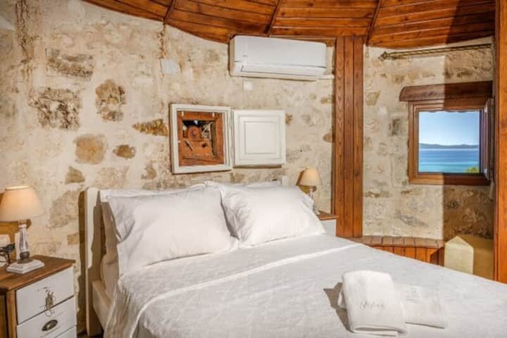 Top-floor bedroom with bay-view window